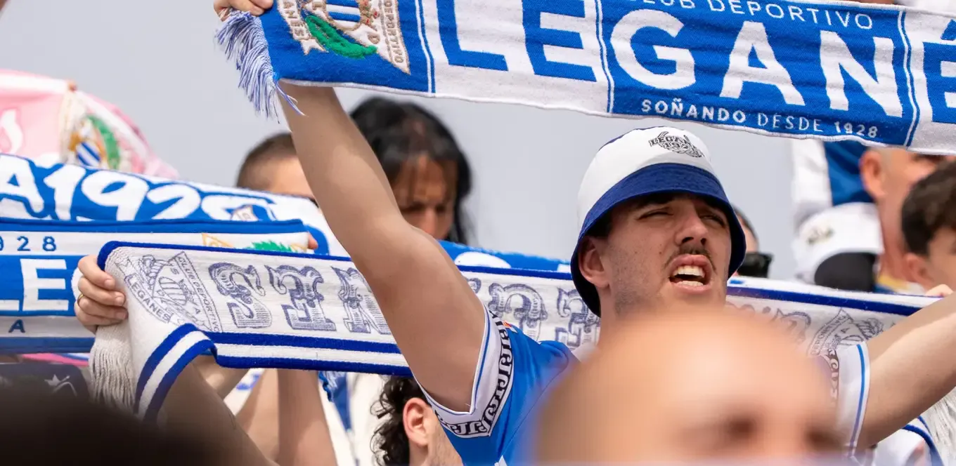 Supporter with a official scarf of C.D. Leganés